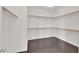 Walk-in closet with wooden rods for hanging clothes at 367 Wilford Springs St, Henderson, NV 89014