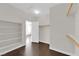 Large walk-in closet featuring wood floors and open shelving at 367 Wilford Springs St, Henderson, NV 89014