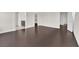 Spacious living room showcasing sleek dark wood floors and open doorway at 367 Wilford Springs St, Henderson, NV 89014
