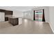Spacious living room featuring tile flooring, abundant natural light, and seamless access to the outdoor area at 367 Wilford Springs St, Henderson, NV 89014