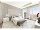 Bright bedroom features large windows with city views, a plush bed, and a modern, neutral color palette at 3750 Las Vegas Blvd # 3301, Las Vegas, NV 89158