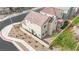 Charming home showcasing a compact backyard with desert landscaping at 393 Desert Cadence St, Henderson, NV 89011