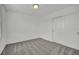 This bedroom features neutral carpeting, crisp white walls, and a spacious closet for ample storage at 393 Desert Cadence St, Henderson, NV 89011
