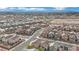 Wide aerial shot of a modern Primary-planned community showcasing uniform housing and community areas at 393 Desert Cadence St, Henderson, NV 89011