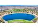 Scenic aerial view of the community lake, showcasing lush landscaping and recreational amenities for residents at 393 Desert Cadence St, Henderson, NV 89011