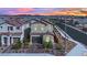 Two-story home with a well-maintained exterior, a two-car garage, and neatly landscaped front yard at 393 Desert Cadence St, Henderson, NV 89011