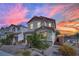 Attractive home with a two-car garage, stone accents, and a landscaped front yard with a walking path at 393 Desert Cadence St, Henderson, NV 89011