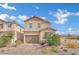 Charming two-story home featuring desert landscaping, a neutral color scheme, and an attached two-car garage at 393 Desert Cadence St, Henderson, NV 89011