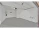Spacious garage with an epoxy floor, white walls, and ample space for vehicles and storage at 393 Desert Cadence St, Henderson, NV 89011