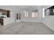 Open-concept living room and kitchen with modern finishes and natural light at 393 Desert Cadence St, Henderson, NV 89011