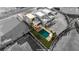 Aerial view showcasing the modern home with a private pool and well-manicured lawn at 3980 Heron Fairway Dr, Las Vegas, NV 89141