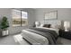 Staged bedroom showcasing a queen-sized bed, side tables, and a view of the mountains at 3980 Heron Fairway Dr, Las Vegas, NV 89141
