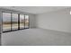 Spacious bedroom with carpet, large windows, and access to balcony at 3980 Heron Fairway Dr, Las Vegas, NV 89141