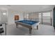 Well lit game room featuring a pool table with balcony access at 3980 Heron Fairway Dr, Las Vegas, NV 89141