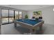 Recreation room with billiards table and balcony access at 3980 Heron Fairway Dr, Las Vegas, NV 89141