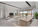 Bright and airy living and dining area with a view of the backyard pool, perfect for relaxation and entertainment at 3980 Heron Fairway Dr, Las Vegas, NV 89141