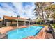 Spacious backyard with sparkling pool, gazebo and lounging areas for outdoor enjoyment at 3991 Shadow Wood Ave, Las Vegas, NV 89121