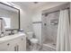 Bathroom with modern vanity, a toilet, and a tiled shower with shower curtain at 3991 Shadow Wood Ave, Las Vegas, NV 89121