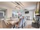 Cozy dining area with a view of the modern kitchen and a brick fireplace at 3991 Shadow Wood Ave, Las Vegas, NV 89121