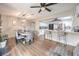 Bright dining area featuring wood floors, stylish furniture, and a modern light fixture at 3991 Shadow Wood Ave, Las Vegas, NV 89121