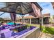 Cozy backyard gazebo with comfortable seating, nearby pool and covered patio at 3991 Shadow Wood Ave, Las Vegas, NV 89121