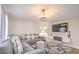 Cozy living room with plush sofa, modern entertainment center, and decorative accents at 3991 Shadow Wood Ave, Las Vegas, NV 89121