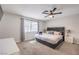 Spacious main bedroom with a ceiling fan and a bright window at 3991 Shadow Wood Ave, Las Vegas, NV 89121