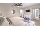 Bright main bedroom featuring a ceiling fan and an ensuite bathroom at 3991 Shadow Wood Ave, Las Vegas, NV 89121