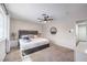 Comfortable main bedroom with a ceiling fan and neutral decor at 3991 Shadow Wood Ave, Las Vegas, NV 89121