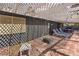 Covered patio with lounge chairs and beautiful pergola with string lights at 3991 Shadow Wood Ave, Las Vegas, NV 89121