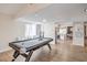 Bright, open recreation room with a pool table and a view into adjacent rooms at 3991 Shadow Wood Ave, Las Vegas, NV 89121