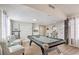 Large recreation room with a pool table, seating area, and views into the kitchen at 3991 Shadow Wood Ave, Las Vegas, NV 89121