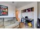 Casual bedroom with lots of wall decor and an open, organized closet space at 4129 Fabulous Finches Ave, North Las Vegas, NV 89084
