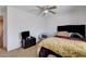 Inviting bedroom with ceiling fan, cozy chair, and ample space at 4129 Fabulous Finches Ave, North Las Vegas, NV 89084