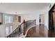 Bright foyer with dark wood floors and wrought iron staircase at 4129 Fabulous Finches Ave, North Las Vegas, NV 89084