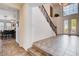 Elegant foyer with tile flooring, staircase with rod iron railing, and natural lighting at 4129 Fabulous Finches Ave, North Las Vegas, NV 89084