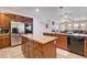 Large open kitchen with stainless steel appliances and kitchen island at 4129 Fabulous Finches Ave, North Las Vegas, NV 89084