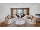 Comfortable living room featuring plush seating and a stylish bar area for entertaining at 4129 Fabulous Finches Ave, North Las Vegas, NV 89084