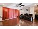 Charming living room area boasting hardwood floors, projector, and recliner seating at 4129 Fabulous Finches Ave, North Las Vegas, NV 89084