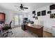 Spacious office featuring multiple work stations, natural light, and decorative artwork at 4129 Fabulous Finches Ave, North Las Vegas, NV 89084
