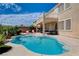 A large pool with desert landscaping in the backyard at 4129 Fabulous Finches Ave, North Las Vegas, NV 89084