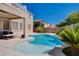 Beautiful backyard pool and patio with an outdoor seating area, perfect for relaxation and entertaining at 4129 Fabulous Finches Ave, North Las Vegas, NV 89084