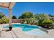 A pool and patio area with landscaping at 4129 Fabulous Finches Ave, North Las Vegas, NV 89084
