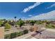 Gorgeous landscape view from a home balcony featuring trees and houses, plus a mountain range at 4129 Fabulous Finches Ave, North Las Vegas, NV 89084