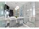 Bright bathroom featuring marble countertops, contemporary lighting, and a glass-enclosed shower at 4381 W Flamingo Rd # 1907, Las Vegas, NV 89103