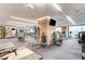 Well-equipped fitness center with cardio machines, weightlifting equipment, and a flat-screen television at 4381 W Flamingo Rd # 1907, Las Vegas, NV 89103