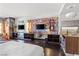 Modern condo living area with colorful artwork, a sleek workspace, and integrated kitchenette at 4381 W Flamingo Rd # 1907, Las Vegas, NV 89103