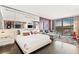 Spacious bedroom features cityscape views, a king bed, and eclectic decor at 4381 W Flamingo Rd # 1907, Las Vegas, NV 89103
