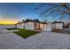 Backyard with artificial grass, white gravel, and a white brick wall at 4667 E Boston Ave, Las Vegas, NV 89104