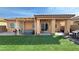 Extensive backyard features synthetic grass, a patio with seating, and a hot tub at 4780 Lorenzo Way, Pahrump, NV 89061